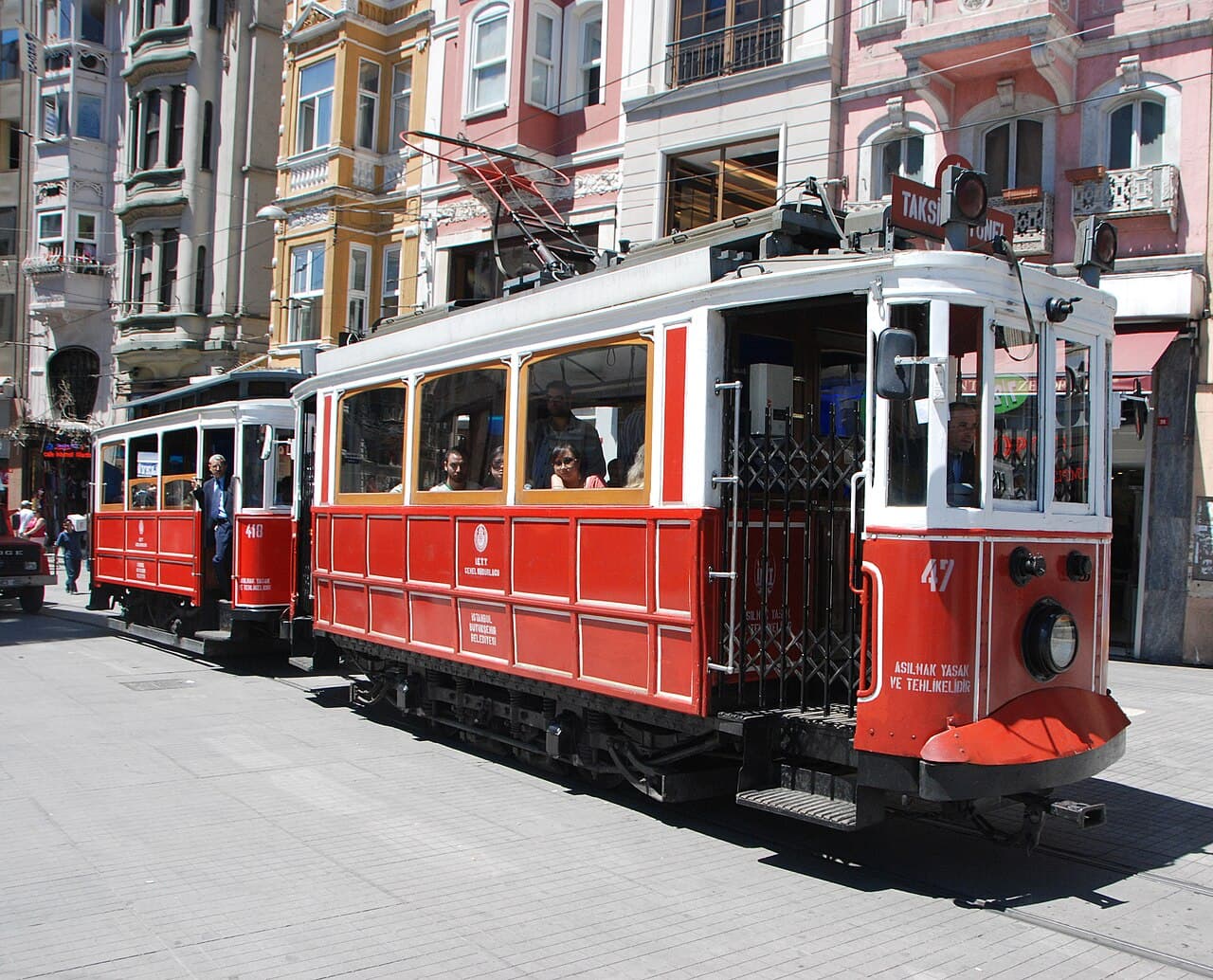 Nostalgic red tram on Istiklal Avenue in Beyoglu, the pedestrian street linking Taksim to the budget hotel side streets